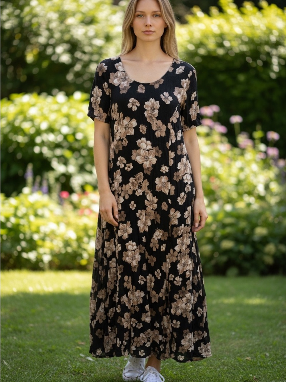 Woman Within Black Maxi Dress with Beige Floral Motif